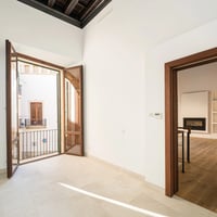 Modern exterior with infinity pool, expansive terraces, and lush landscaping. Minimalist design and high-quality finishes.