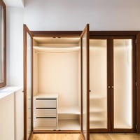 Exterior view of a modern home with a pool, spacious garden, and designer facade. Warm lighting highlights the architecture.