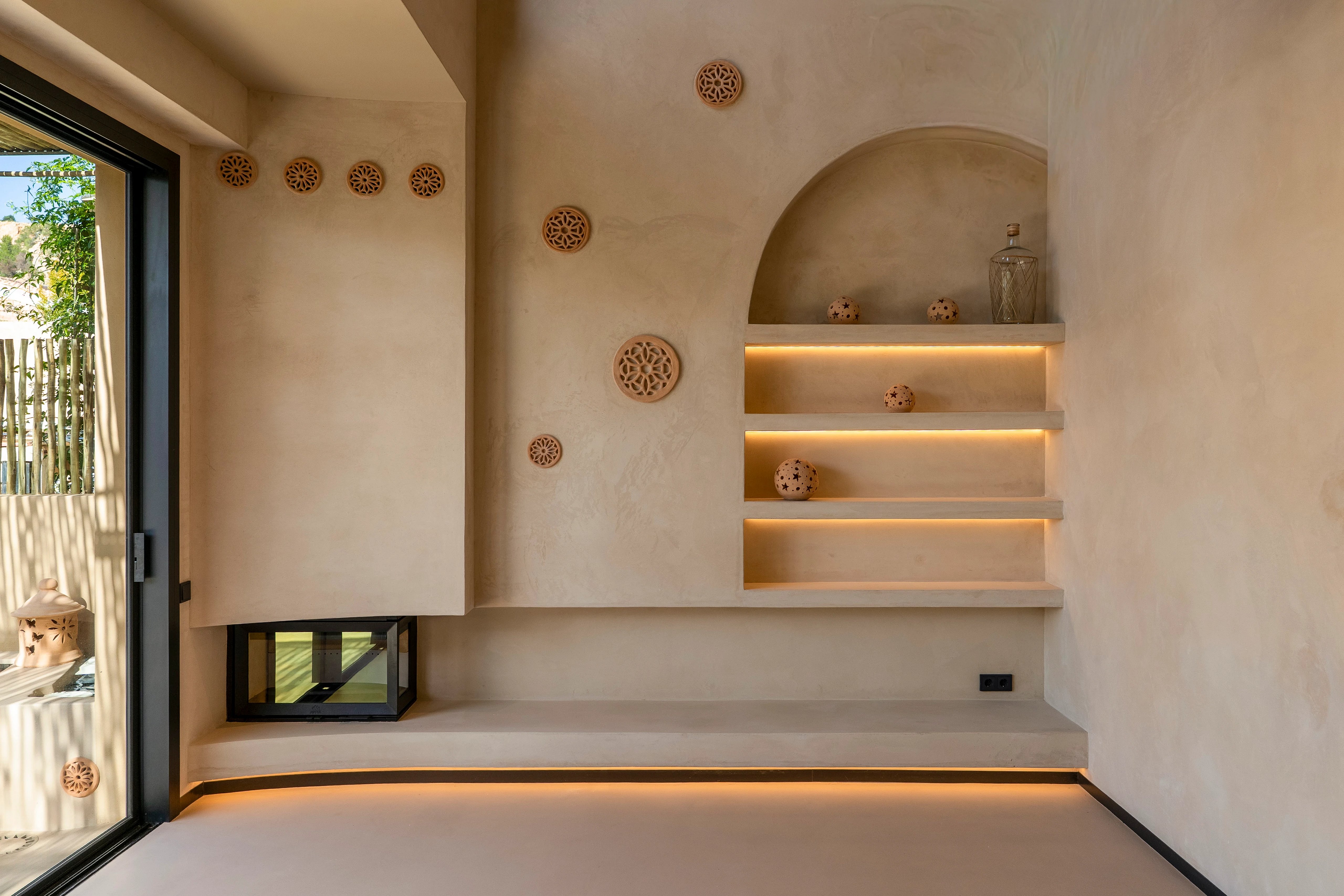 Spacious living room overlooking garden and pool. Modern design, large windows, natural lighting. Minimalist and elegant interior design.