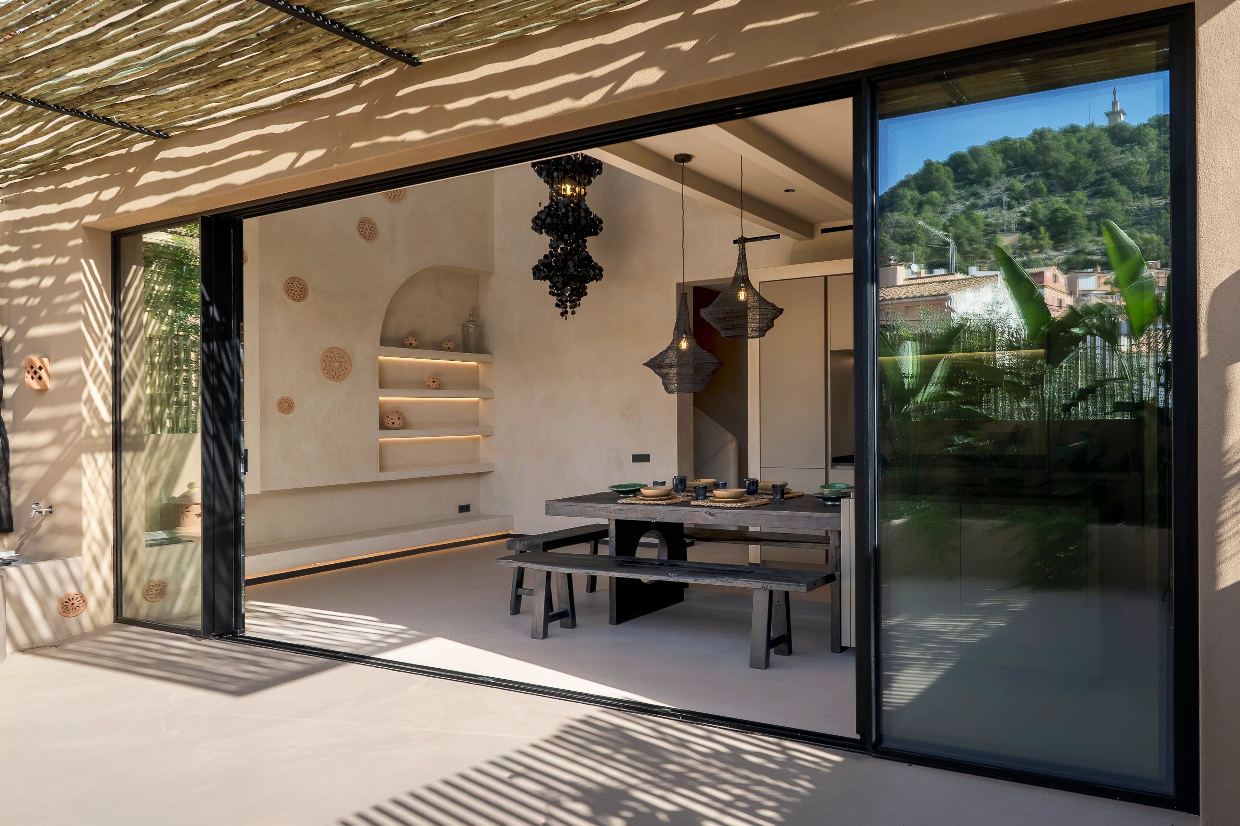 Modern kitchen with central island, granite countertops, stainless steel appliances, and recessed lighting. Elegant and functional design.