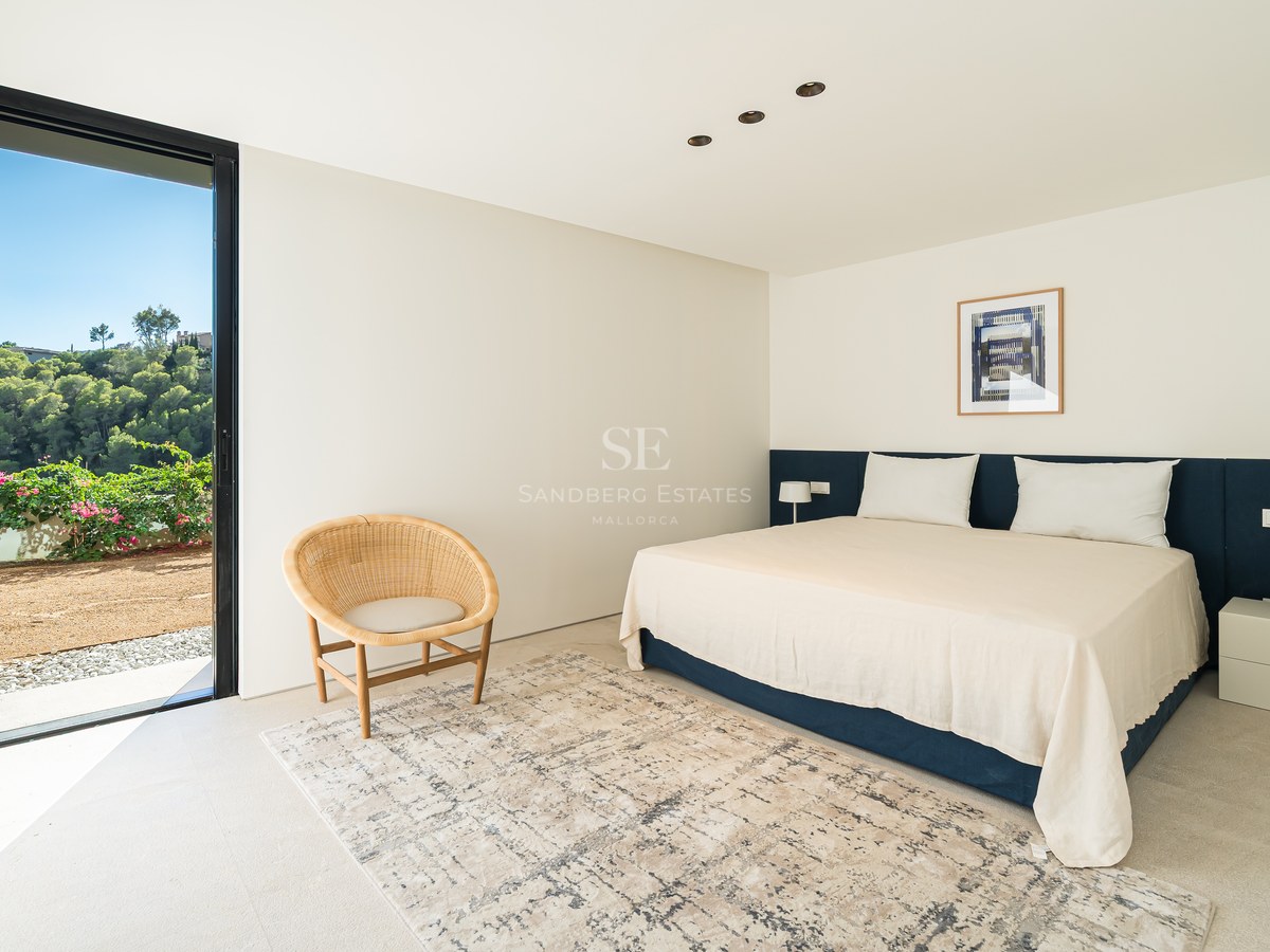 View of a modern villa with infinity pool, lush greenery, and minimalist architectural design. Natural lighting.