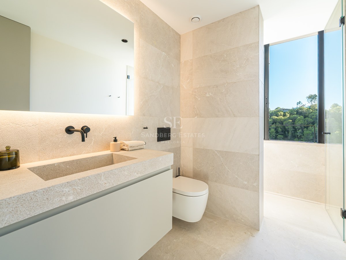Spacious balcony with panoramic sea views. Modern design, glass railing, and elegant furniture. Bright and airy.