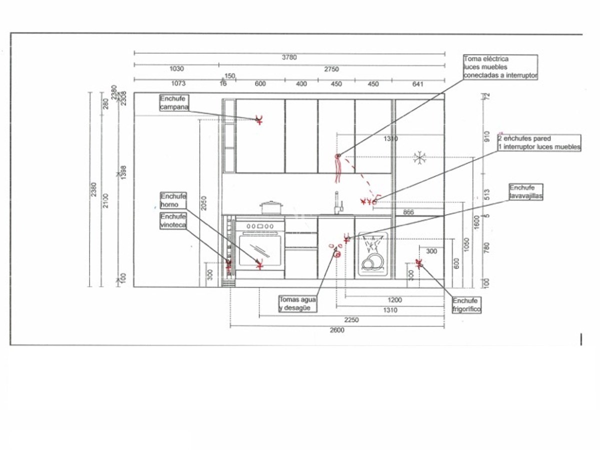 Technical drawing of a kitchen layout with measurements and markings for electrical and plumbing connections.