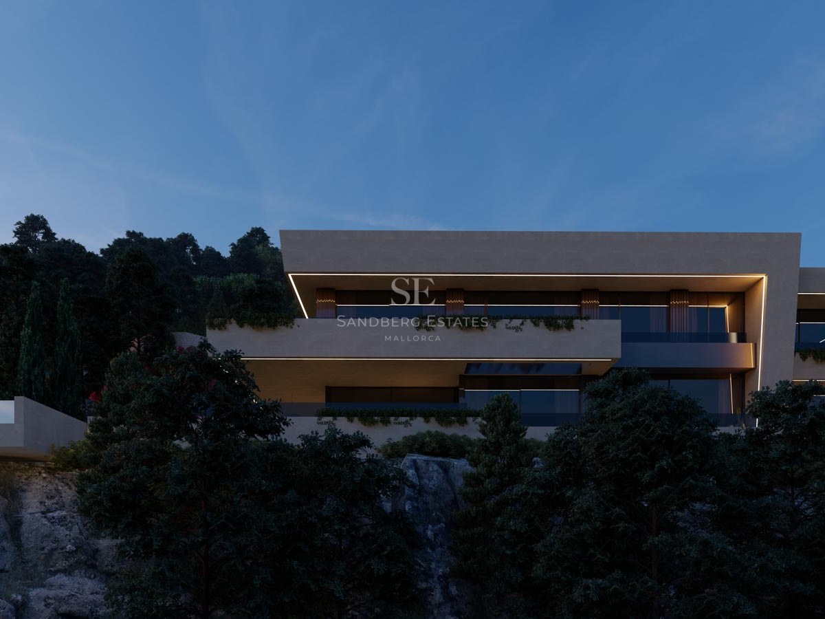 Modern flernivåvilla med LED-belysning i skymningen på en skogsklädd bergssluttning.