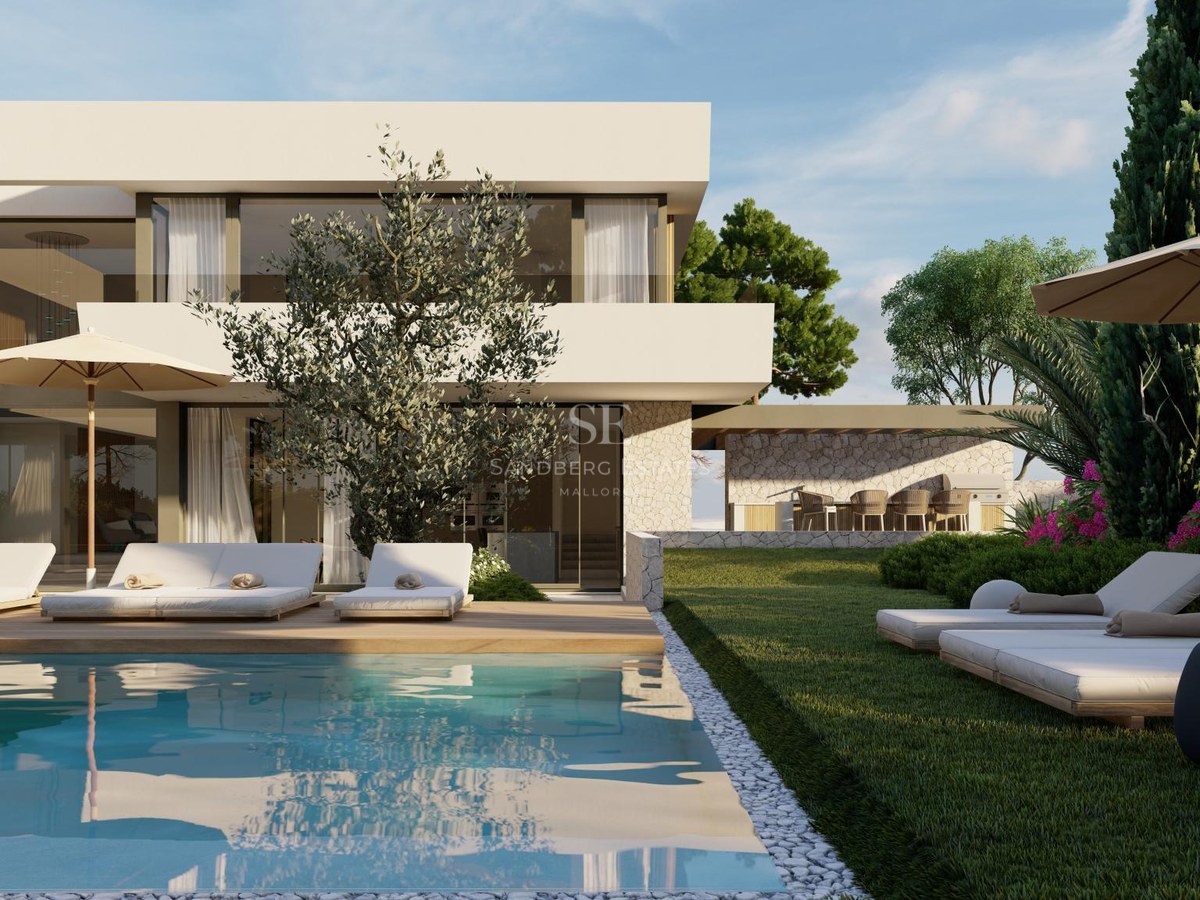 Modern two-story villa with large pool, sun loungers on a wooden deck, and manicured lawns under a clear blue sky.