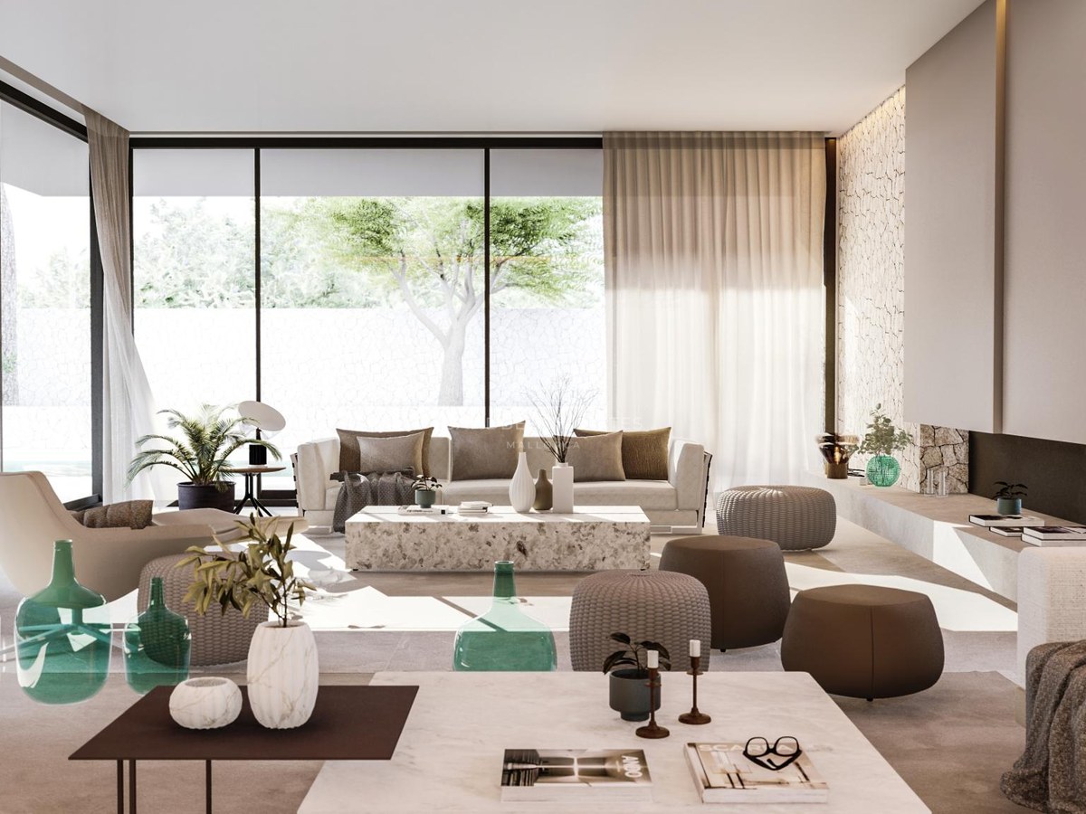 Bright open-plan living room featuring floor-to-ceiling windows, natural stone coffee table, and neutral designer sofas.