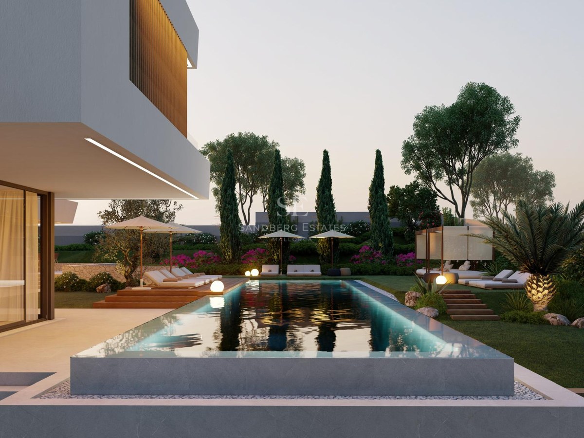 Infinity edge swimming pool with ambient lighting next to a modern white villa and landscaped garden at dusk.