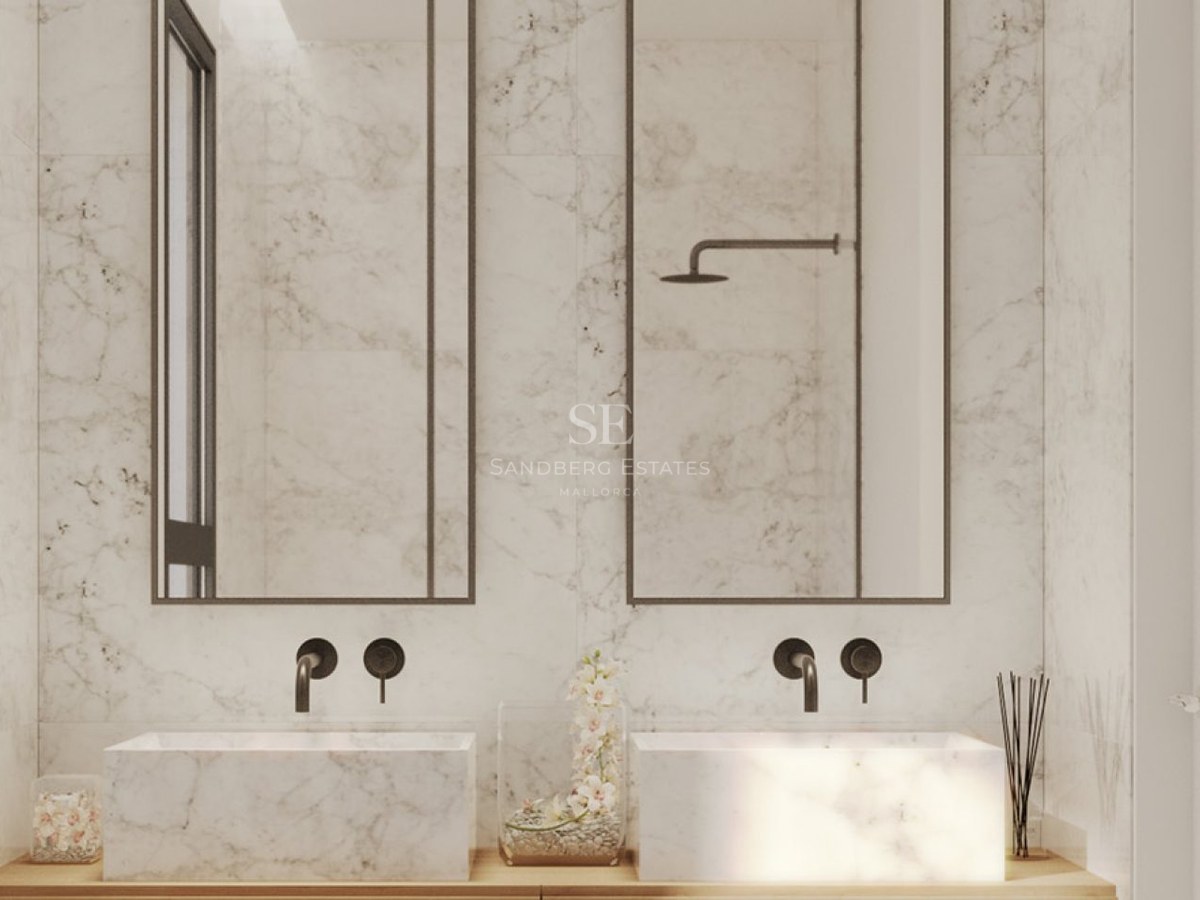 Modern master bathroom with two white marble vessel sinks, matte black wall-mounted faucets, and tall mirrors.