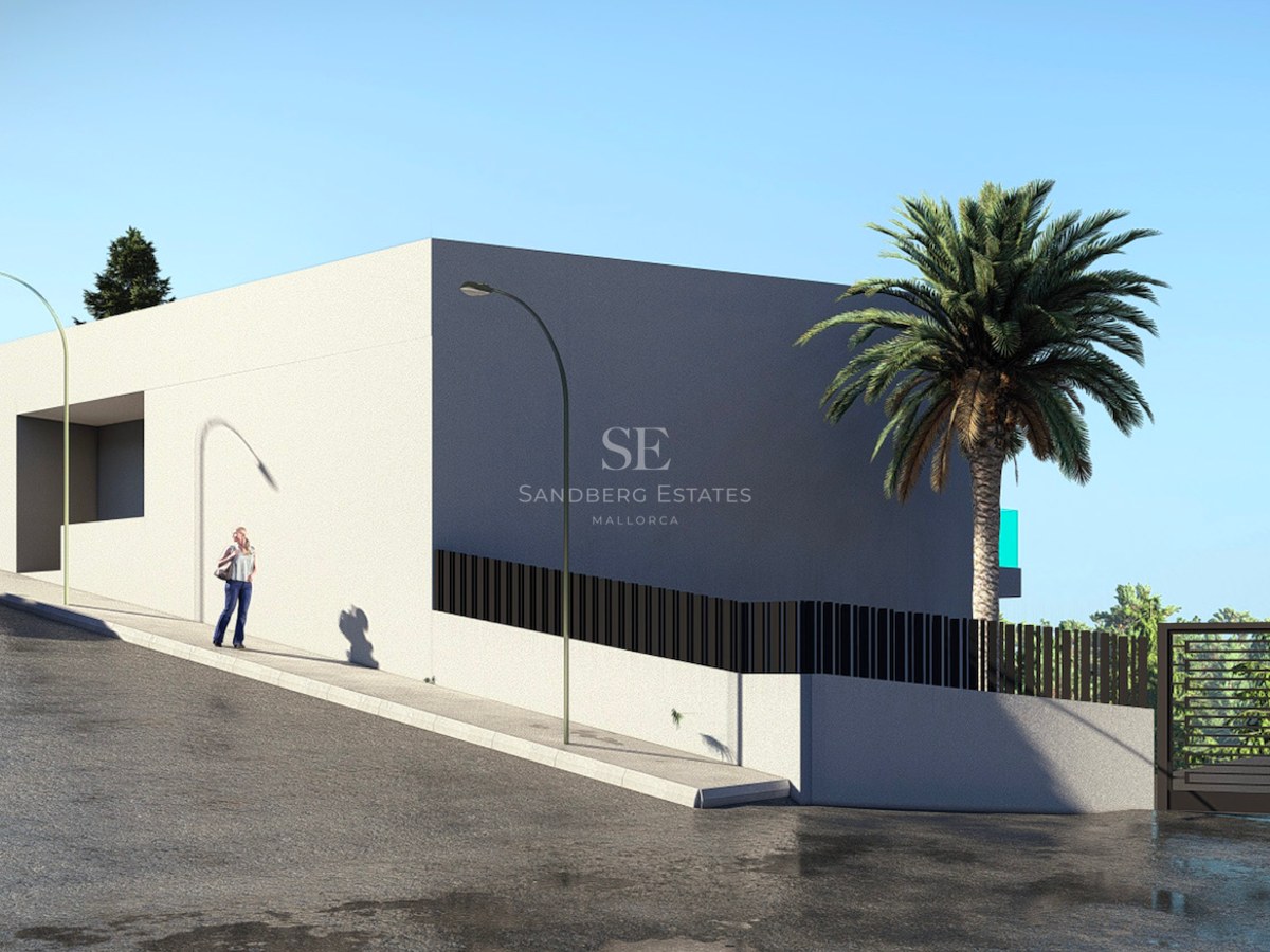 A modern white villa entrance on a sloped street with black metal fencing, a palm tree, and a secure gated entry.