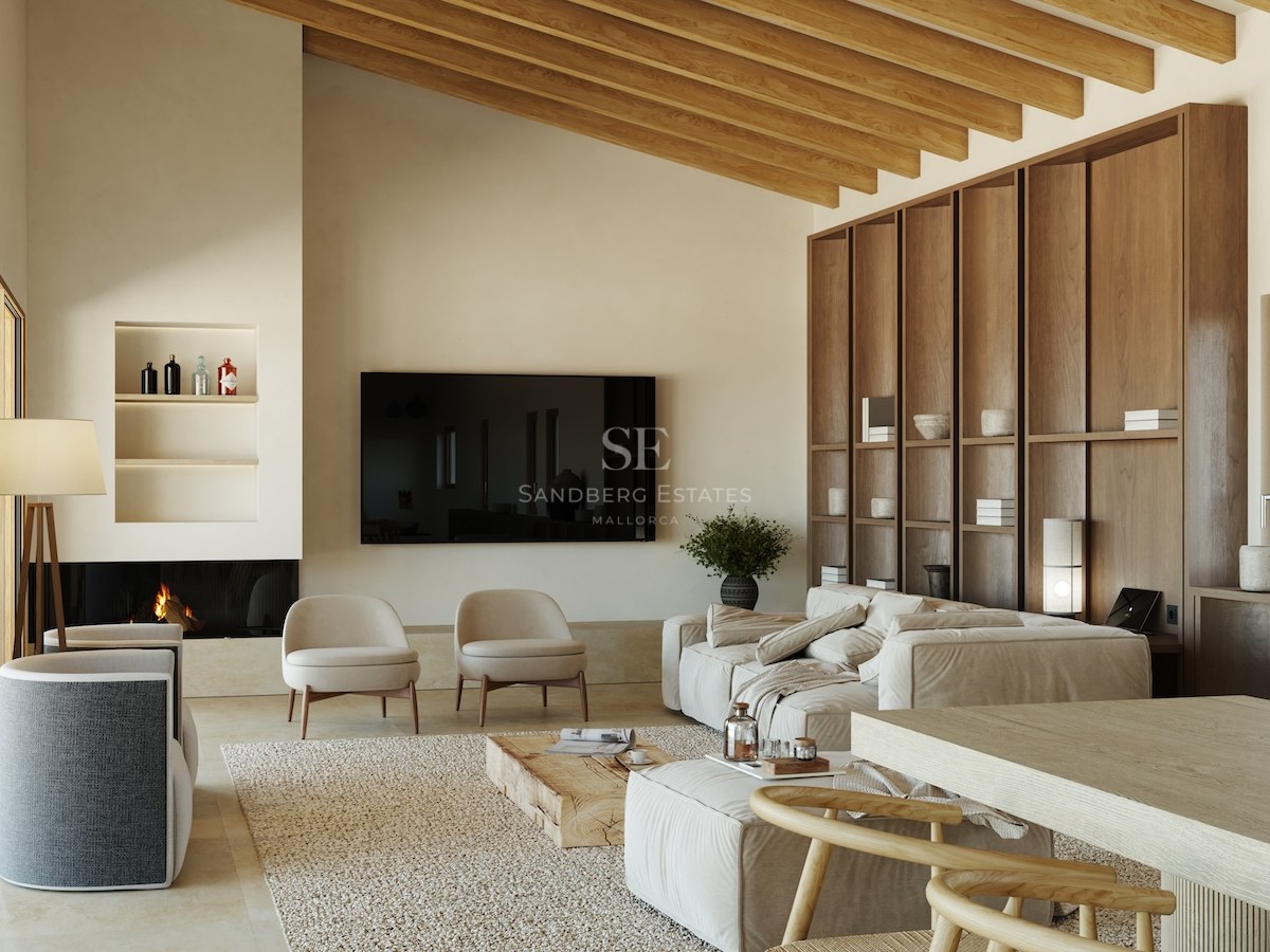 Geräumiges Wohnzimmer mit hohen Balkendecken, beige Leinen-Sofa, Holzregalen und minimalistischem Kamin.