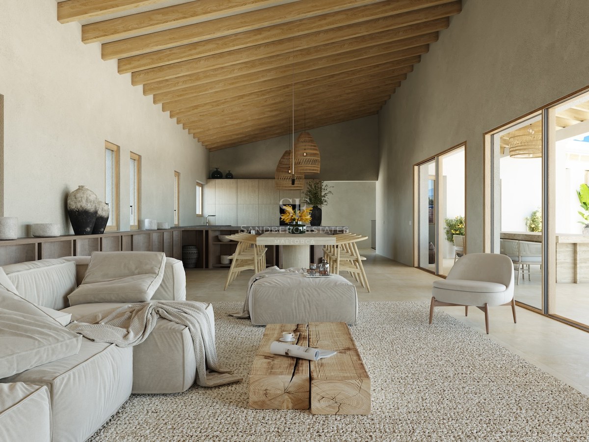 Großzügiges modernes Wohnzimmer mit hohen Holzbalkendecken, neutralen Möbeln und großen Glastüren zur Terrasse.