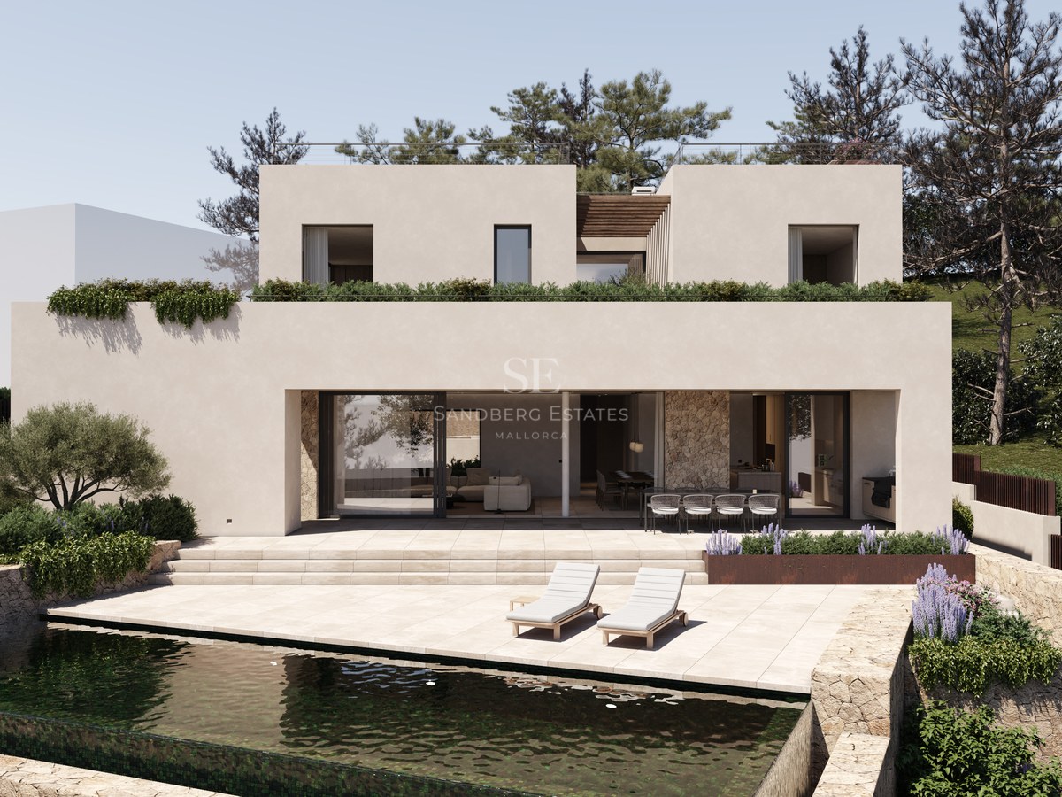 Villa contemporaine de deux étages avec piscine, accents en pierre et jardins paysagers sous un ciel dégagé.