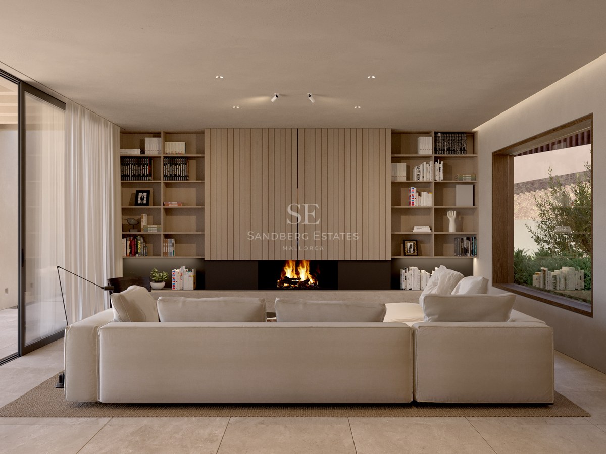 Salon minimaliste avec grand canapé beige, cheminée intégrée sous panneaux de bois et grandes baies vitrées.