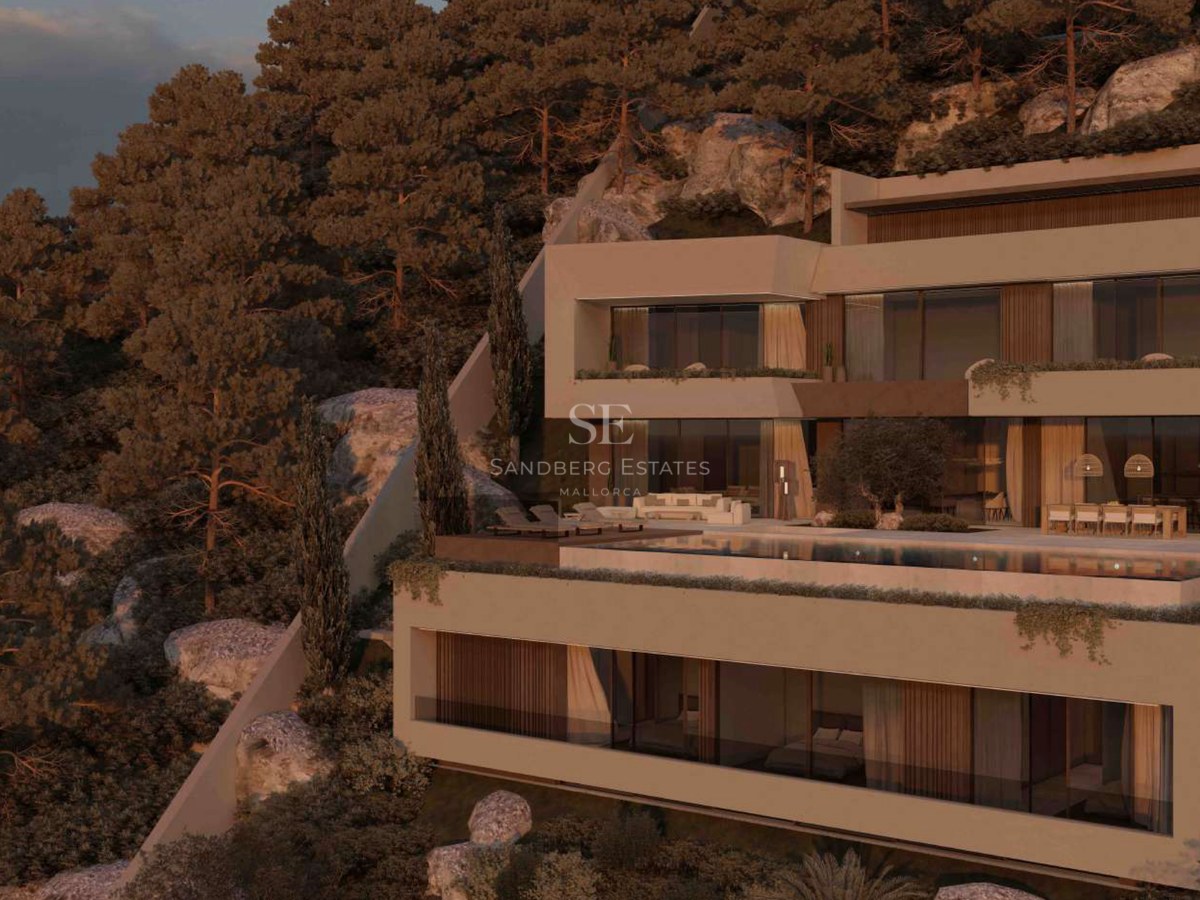 Villa moderna de varios niveles integrada en una ladera rocosa con piscina infinita y amplios ventanales al atardecer.