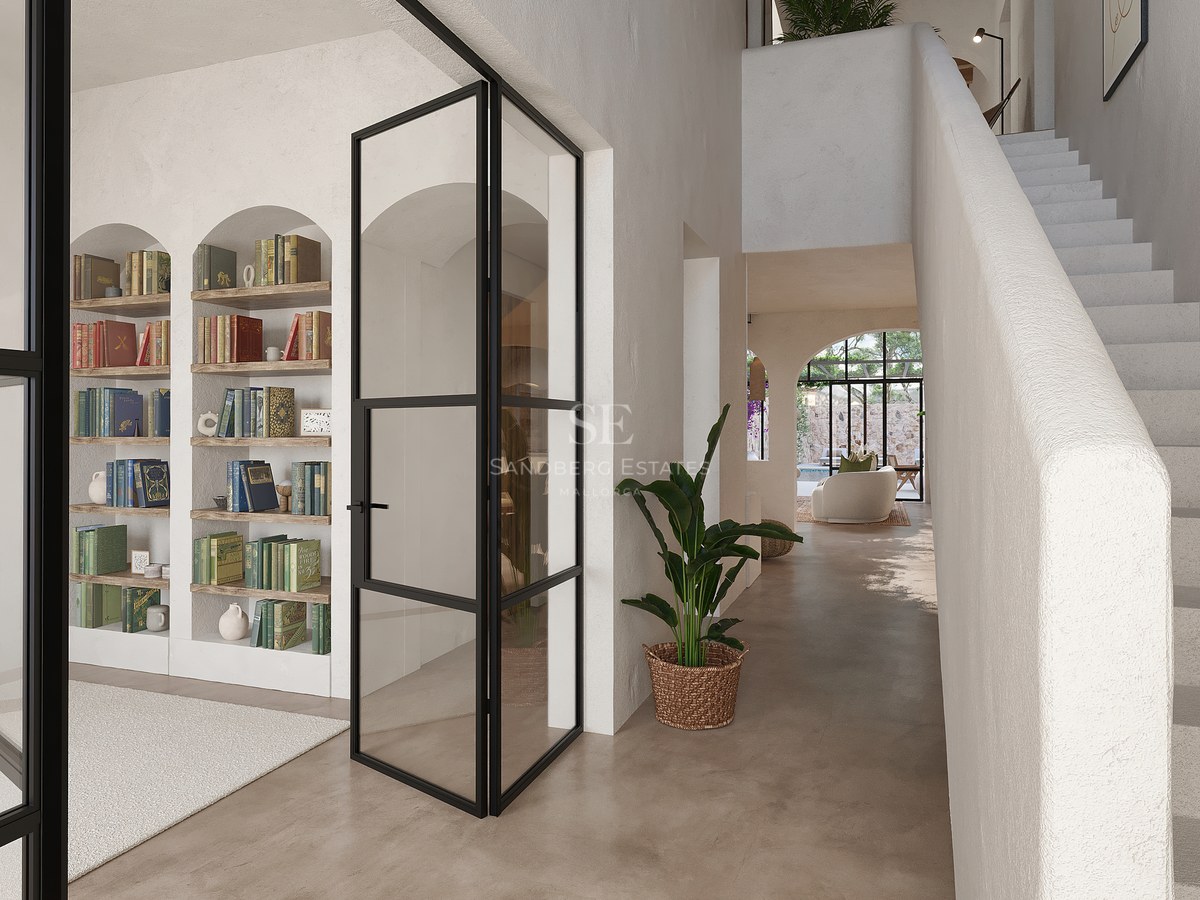 Couloir lumineux avec étagères cintrées intégrées, portes vitrées noires et escalier blanc minimaliste.