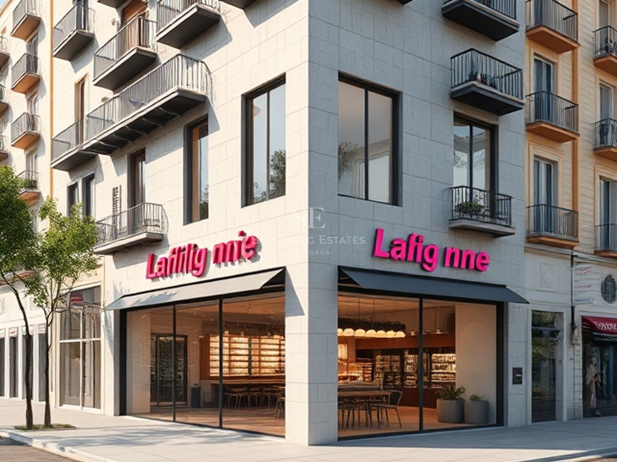 Exterior view of a modern multi-story corner building with cream stone cladding and minimalist black balconies.