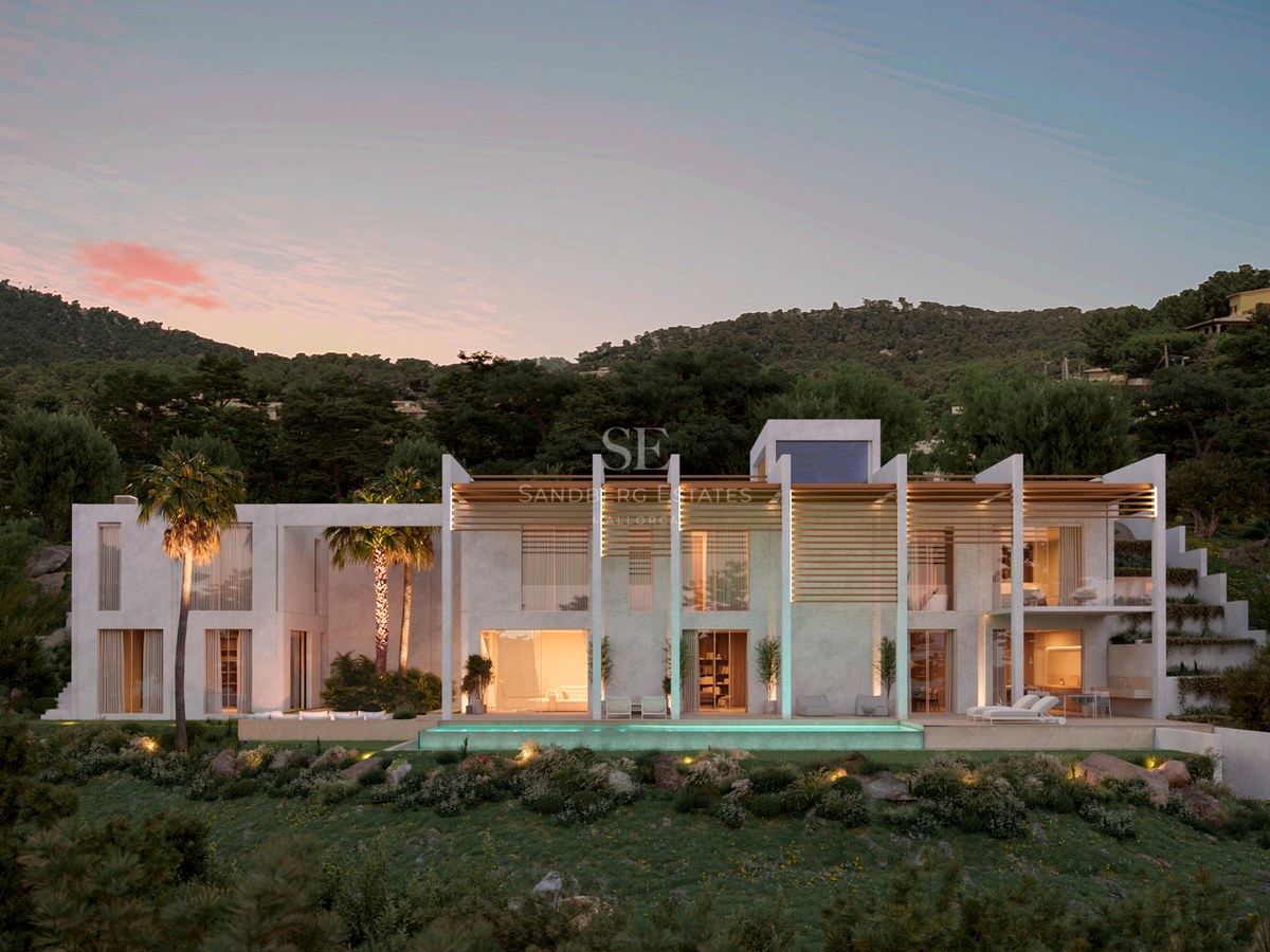 Modern white villa facade at dusk with infinity pool and palm trees against a lush hillside.