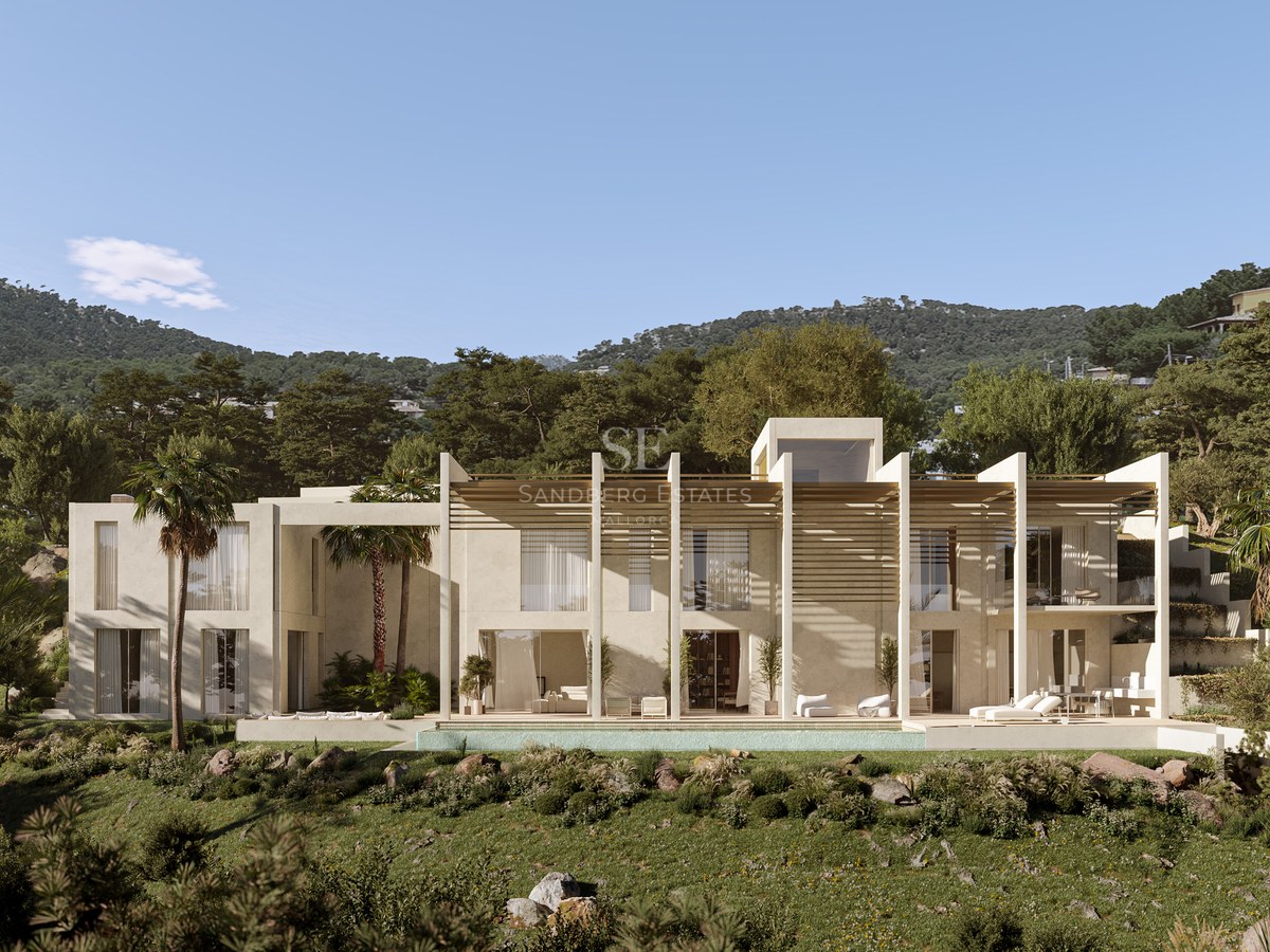 Contemporary two-story white stone villa with long infinity pool, wood pergolas, and mountains in the background.