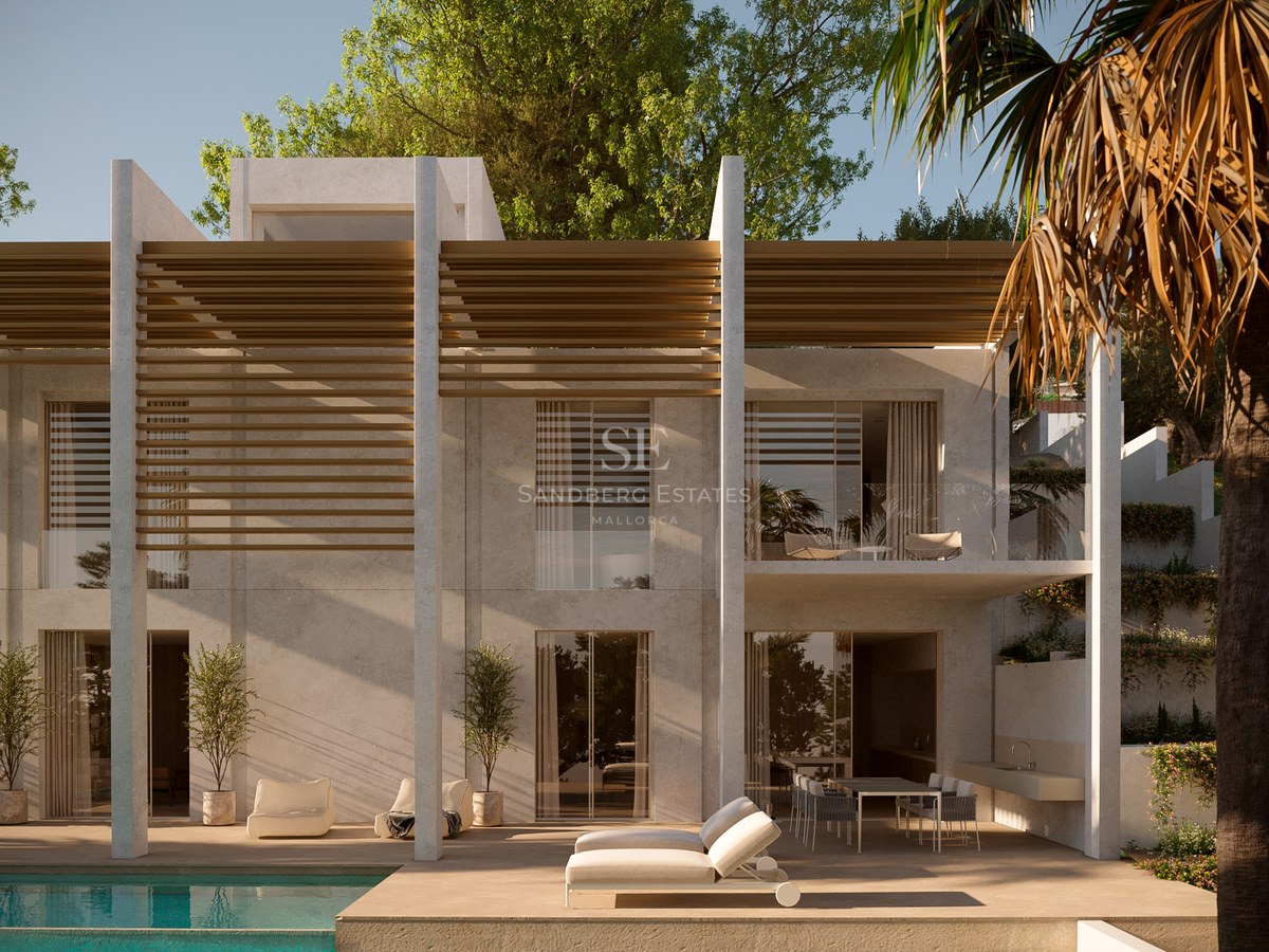 Exterior view of a modern two-story villa featuring white stone walls, wooden slats, and a poolside lounge area.