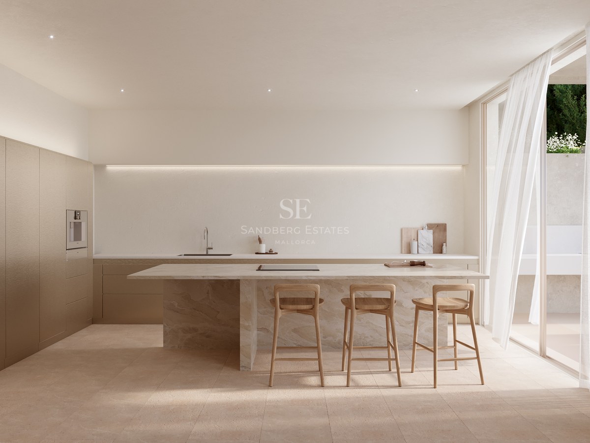 A neutral-toned kitchen featuring a large marble island with three wooden bar stools and integrated linear lighting.