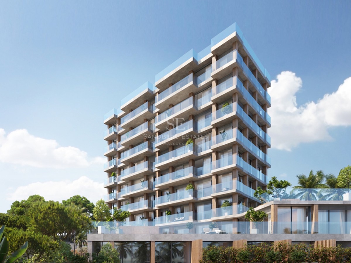 Exterior view of a modern multi-story apartment building with glass balconies and natural stone textures.