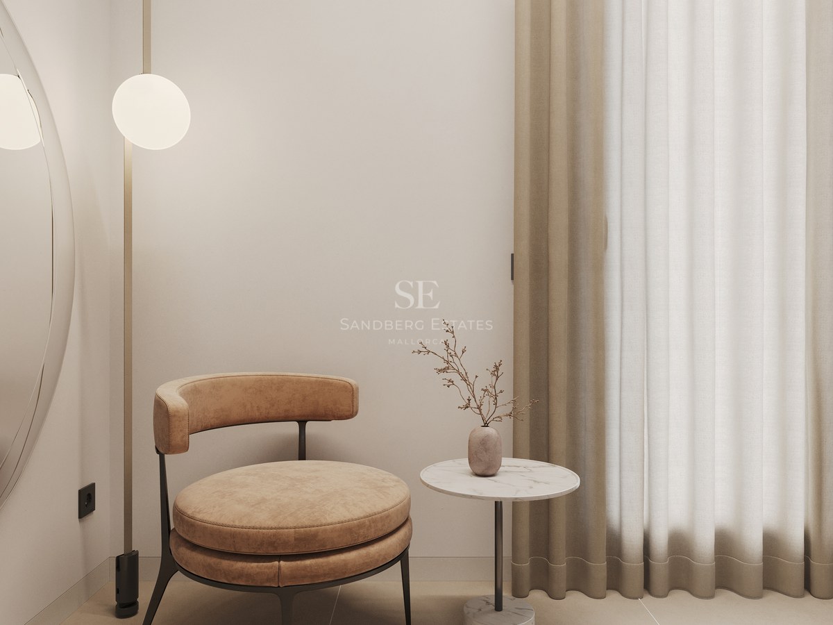 Modern leather armchair next to a marble side table and floor-to-ceiling designer lamp in a minimalist room.