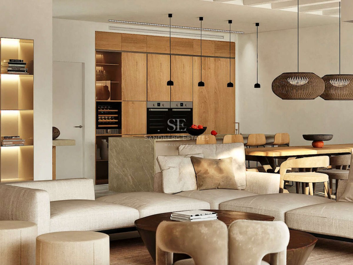 Salon contemporain avec canapé crème, îlot en marbre et menuiserie en bois sous un éclairage chaleureux.