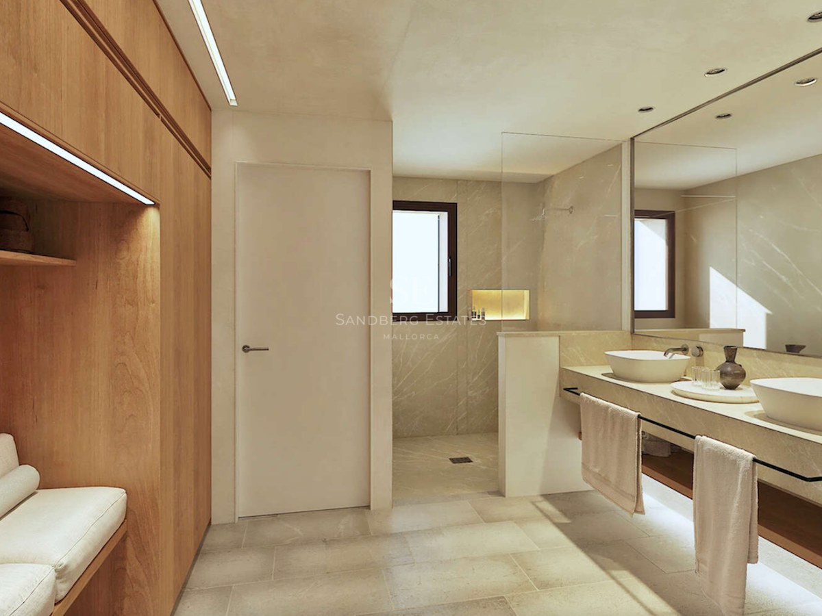 Salle de bains moderne avec douche à l'italienne, double vasque et menuiseries en bois clair.