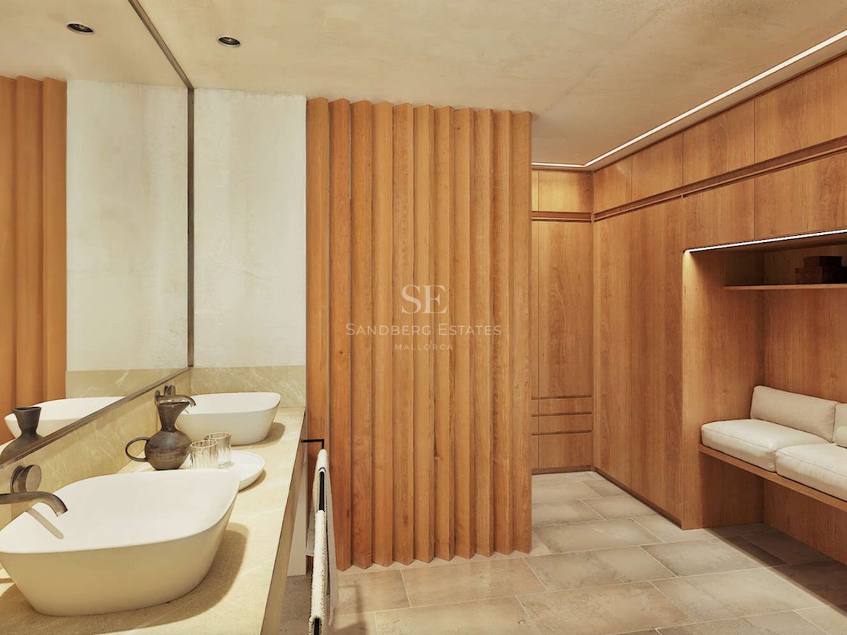 Salle de bain contemporaine avec double vasque blanche et parois en bois cannelé menant à un dressing.