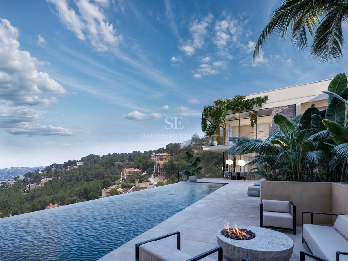 Piscine à débordement de luxe surplombant la mer avec terrasse en pierre, salon extérieur et villa contemporaine.