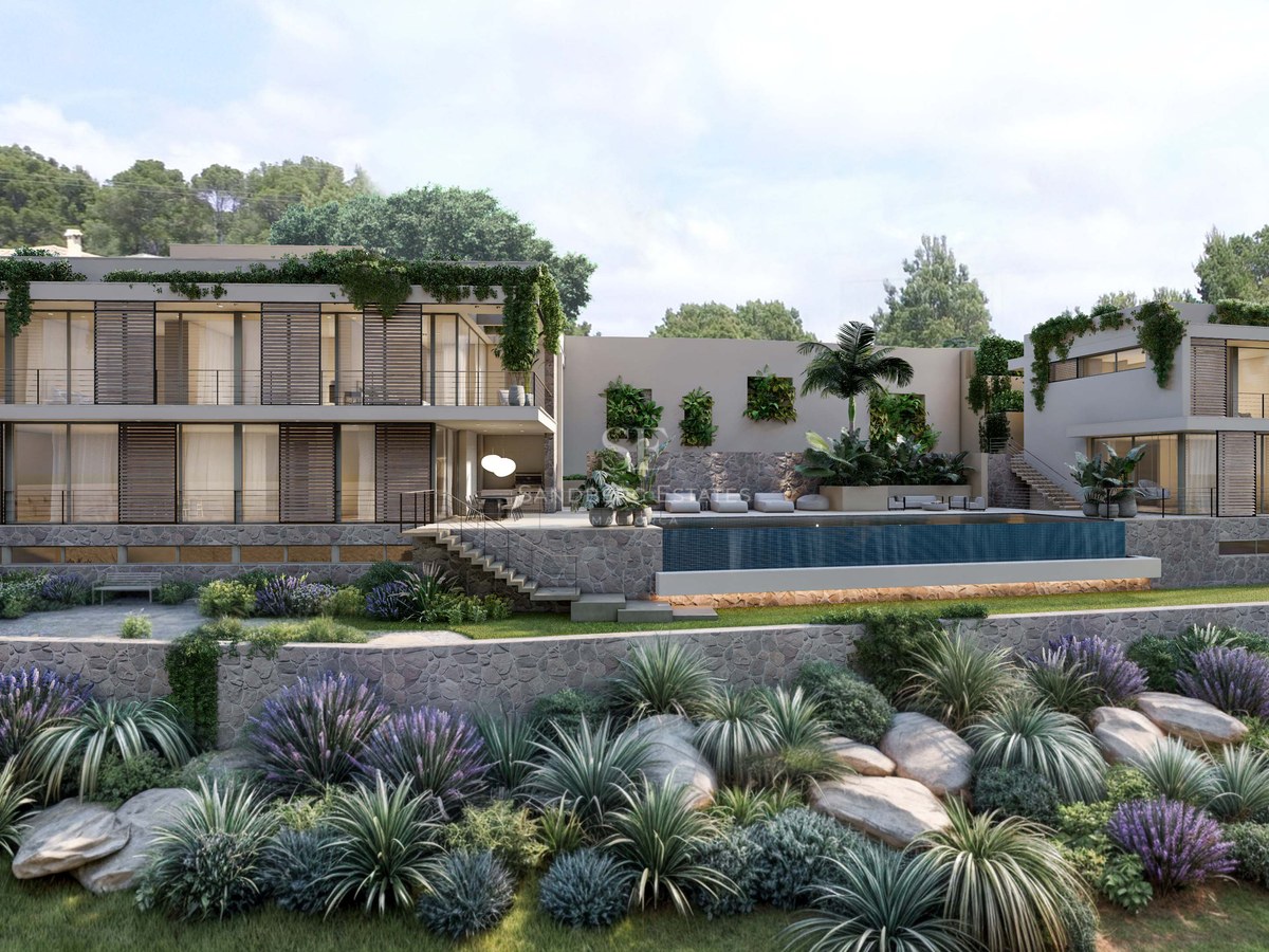 Vue extérieure d'une villa moderne à plusieurs niveaux avec baies vitrées, pierre naturelle et piscine à débordement.
