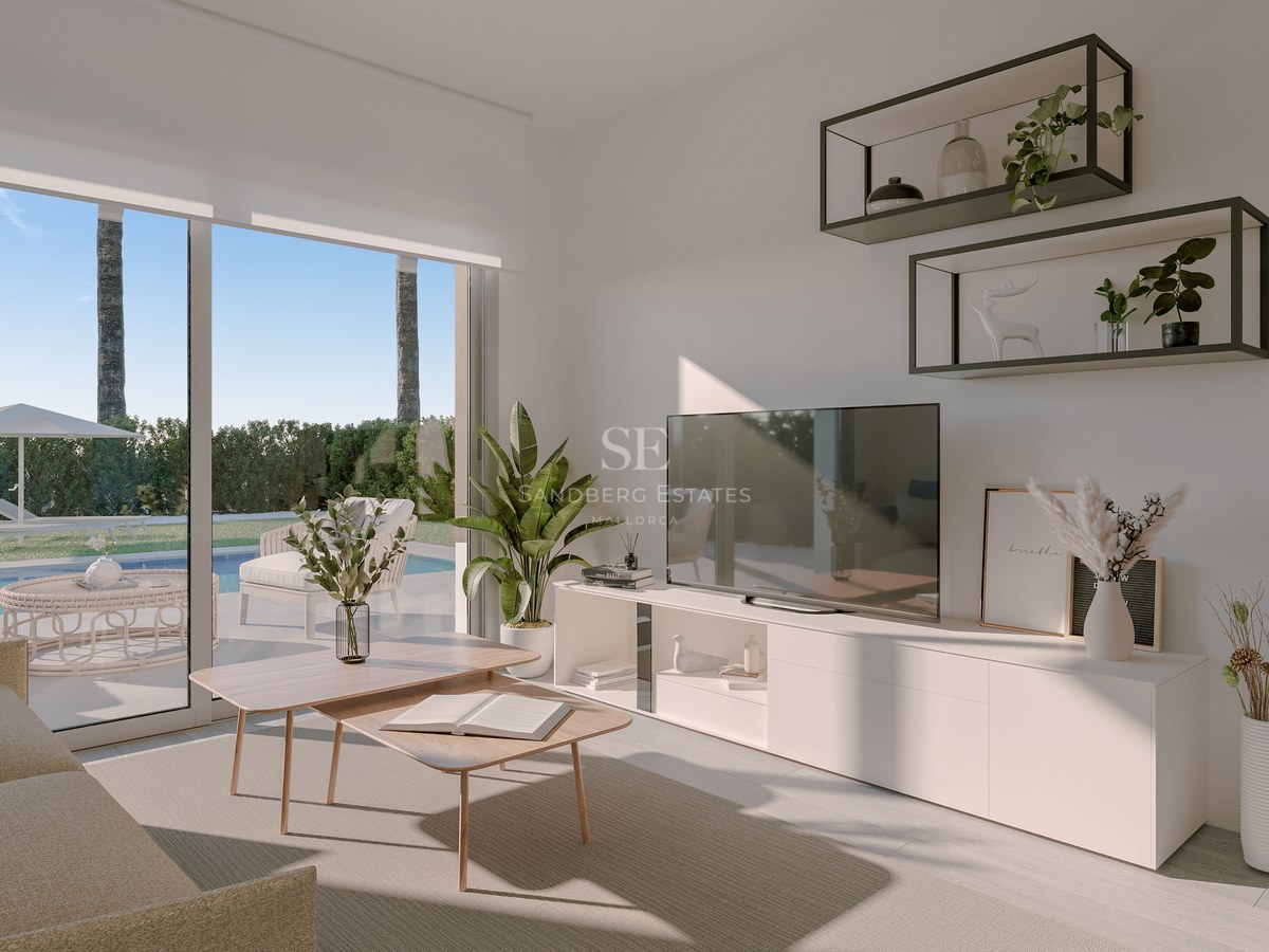 Contemporary living room with white cabinetry, wooden tables, and large glass doors opening to a pool terrace.