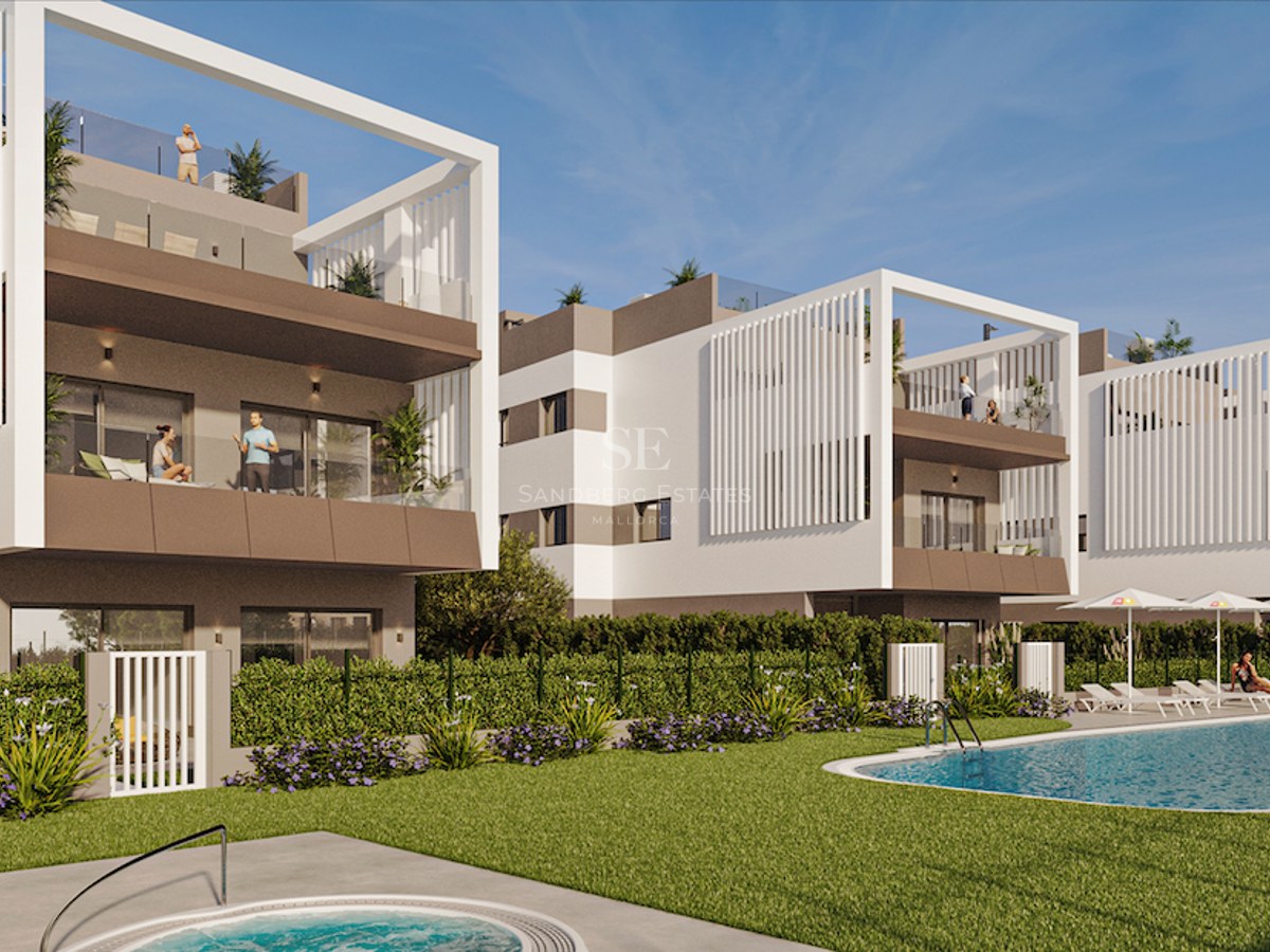 Modern white apartment complex featuring a large swimming pool, green lawn, and expansive terraces under a clear blue sky.