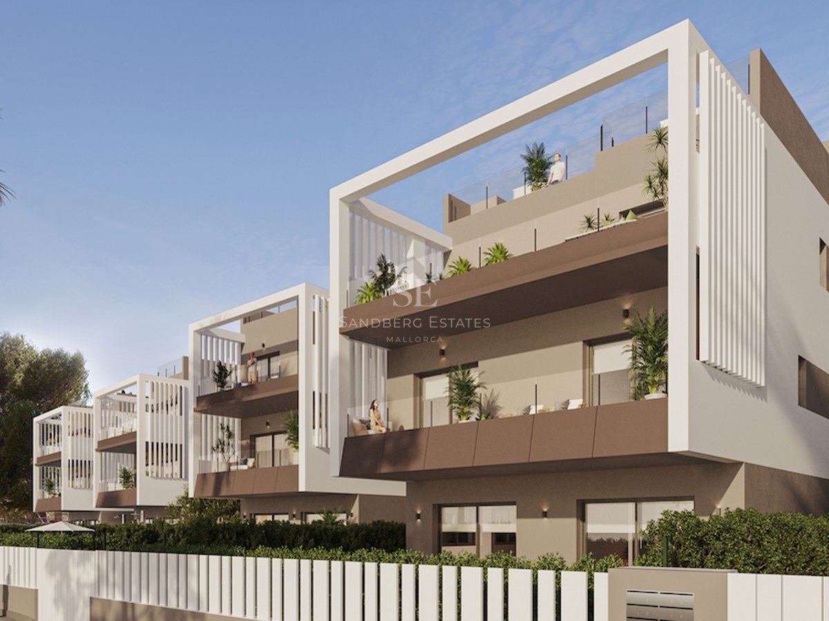Modern multi-story apartment building with white and taupe facades, glass balconies, and rooftop solariums.