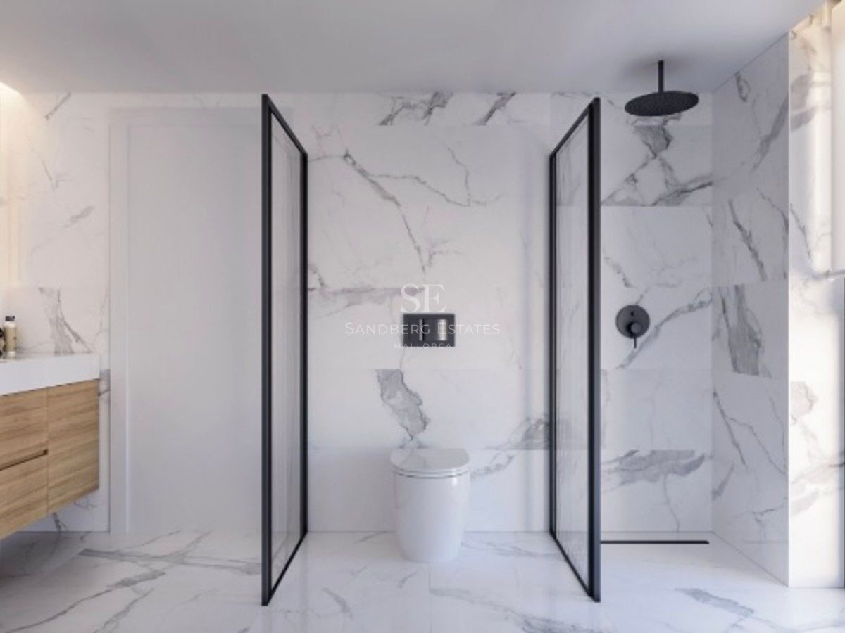 Contemporary bathroom featuring marble walls, a walk-in shower with black frames, and a wooden floating vanity.