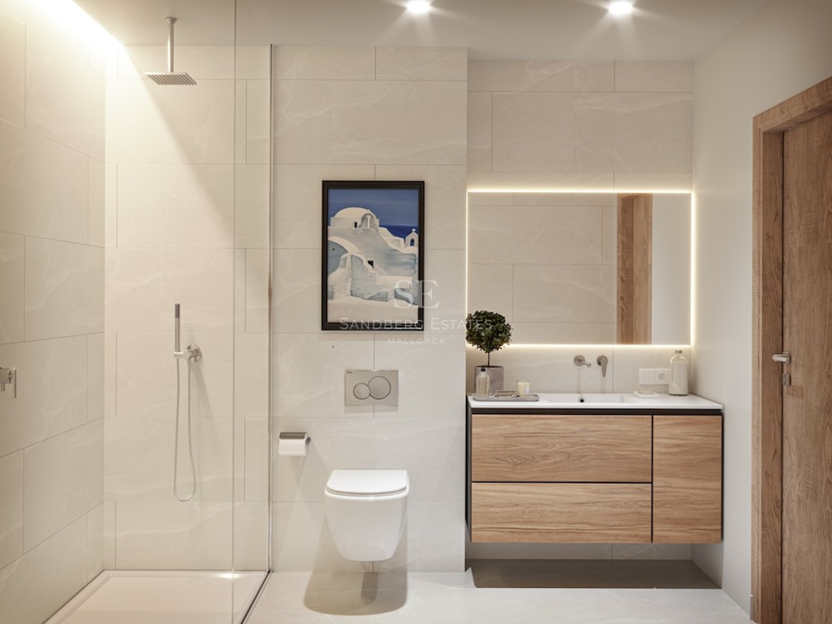 Modern bathroom with beige tiles, floating wood vanity, backlit mirror, and glass walk-in shower.