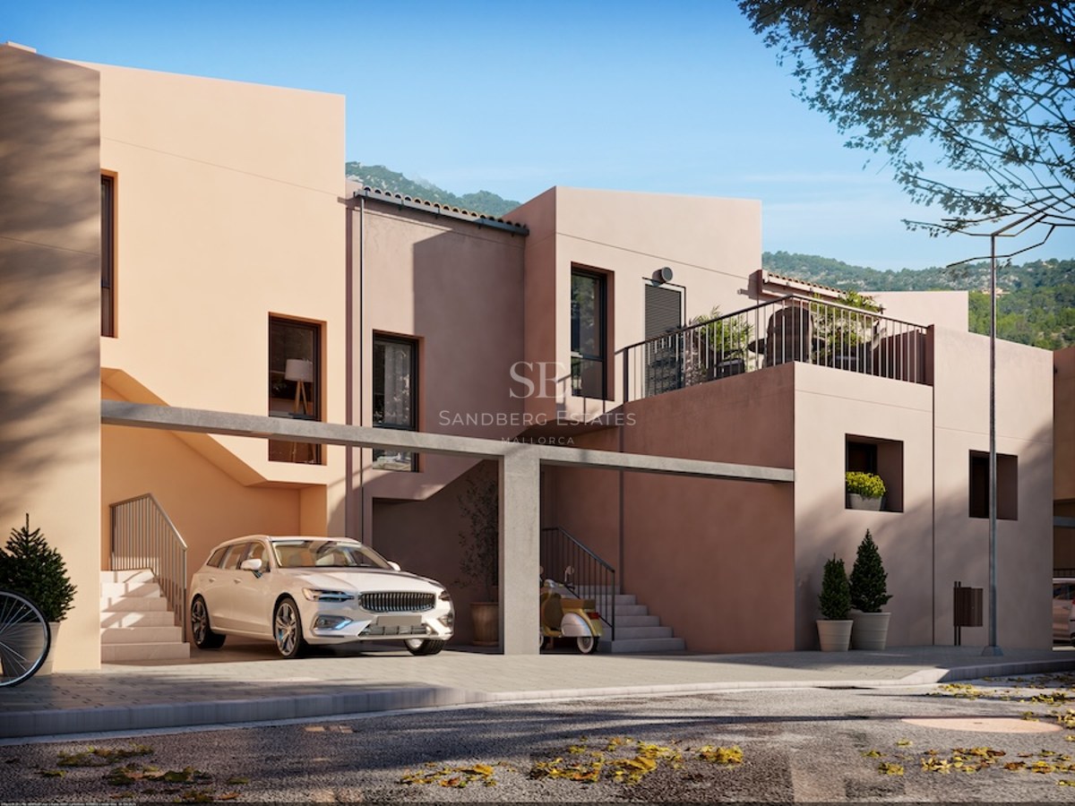 Modern multi-level home with peach-colored walls, a covered parking area with a white car, and architectural stairs.