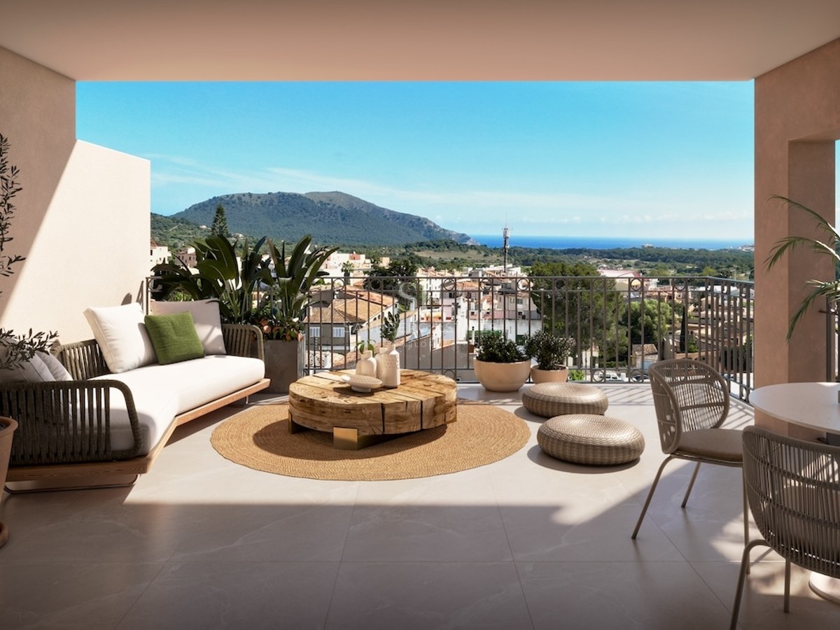 A modern terrace with designer furniture, natural wood coffee table, and panoramic views of the sea and mountains.