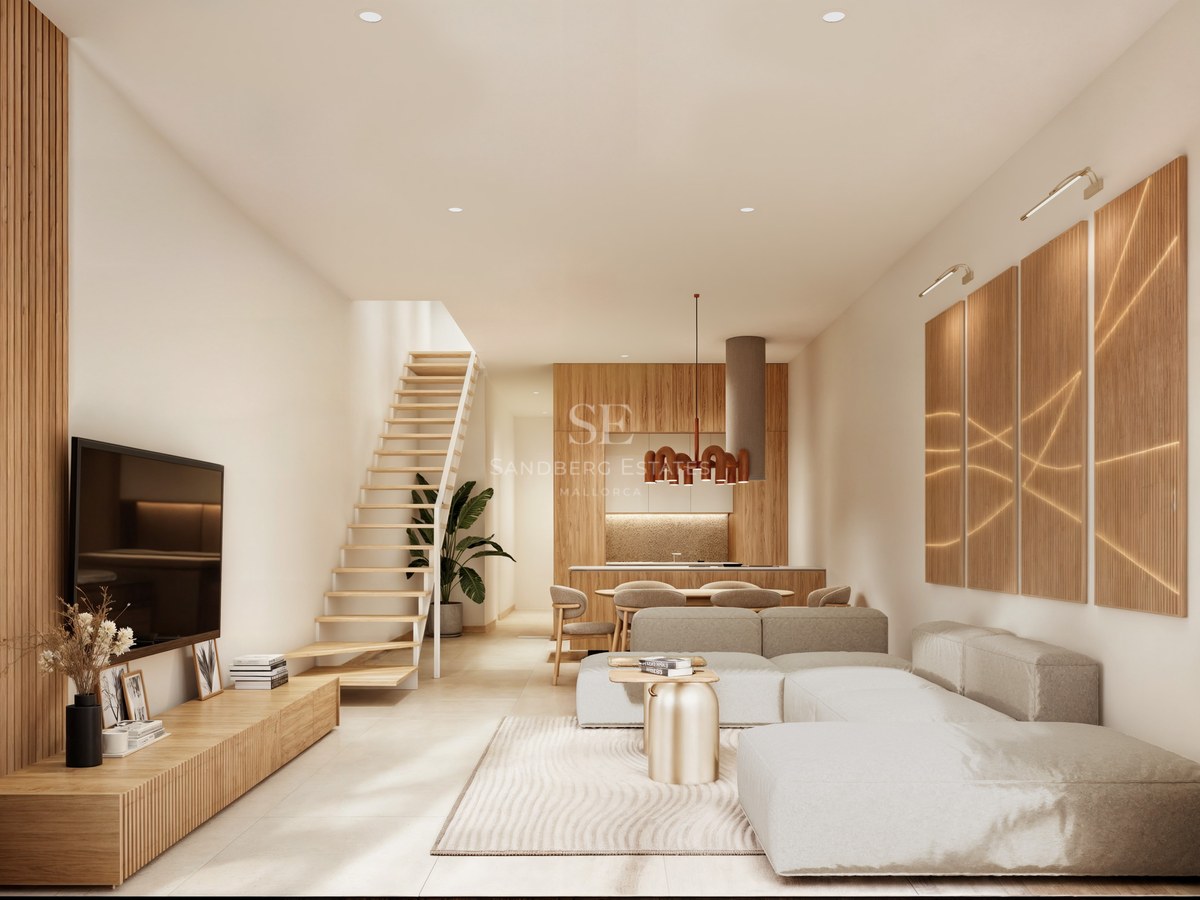 Modern living room with a large modular sofa, light wood staircase, and slatted wood wall panels in a bright interior.