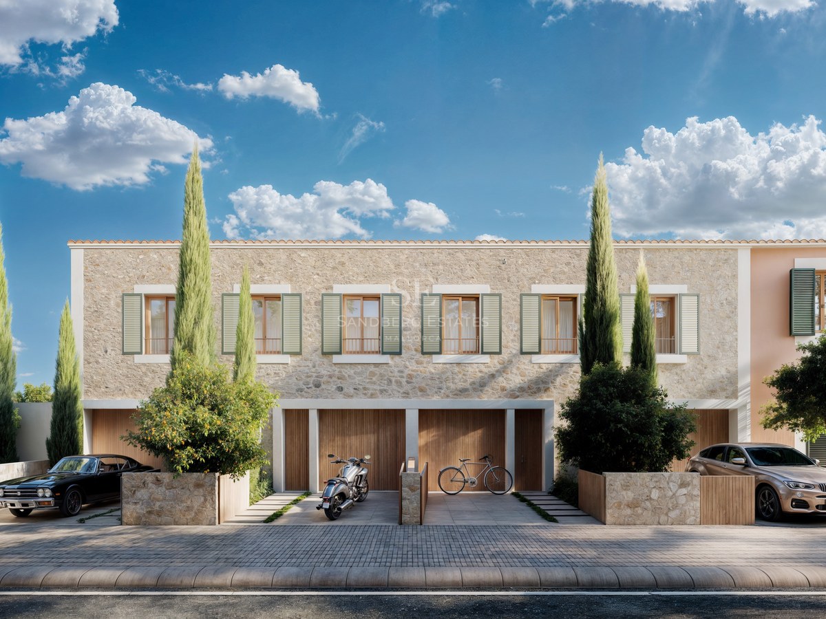 Elegant stone villa facade featuring wooden shutters, tall cypress trees, and luxury vehicles parked in front.