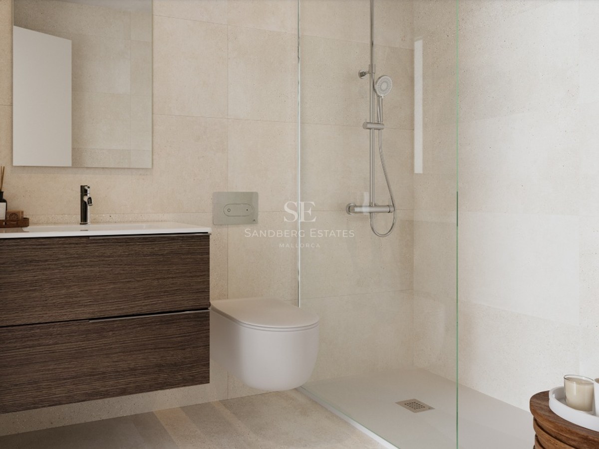 Modern bathroom featuring a dark wood floating vanity, wall-mounted toilet, and glass-enclosed walk-in shower with beige tiles.
