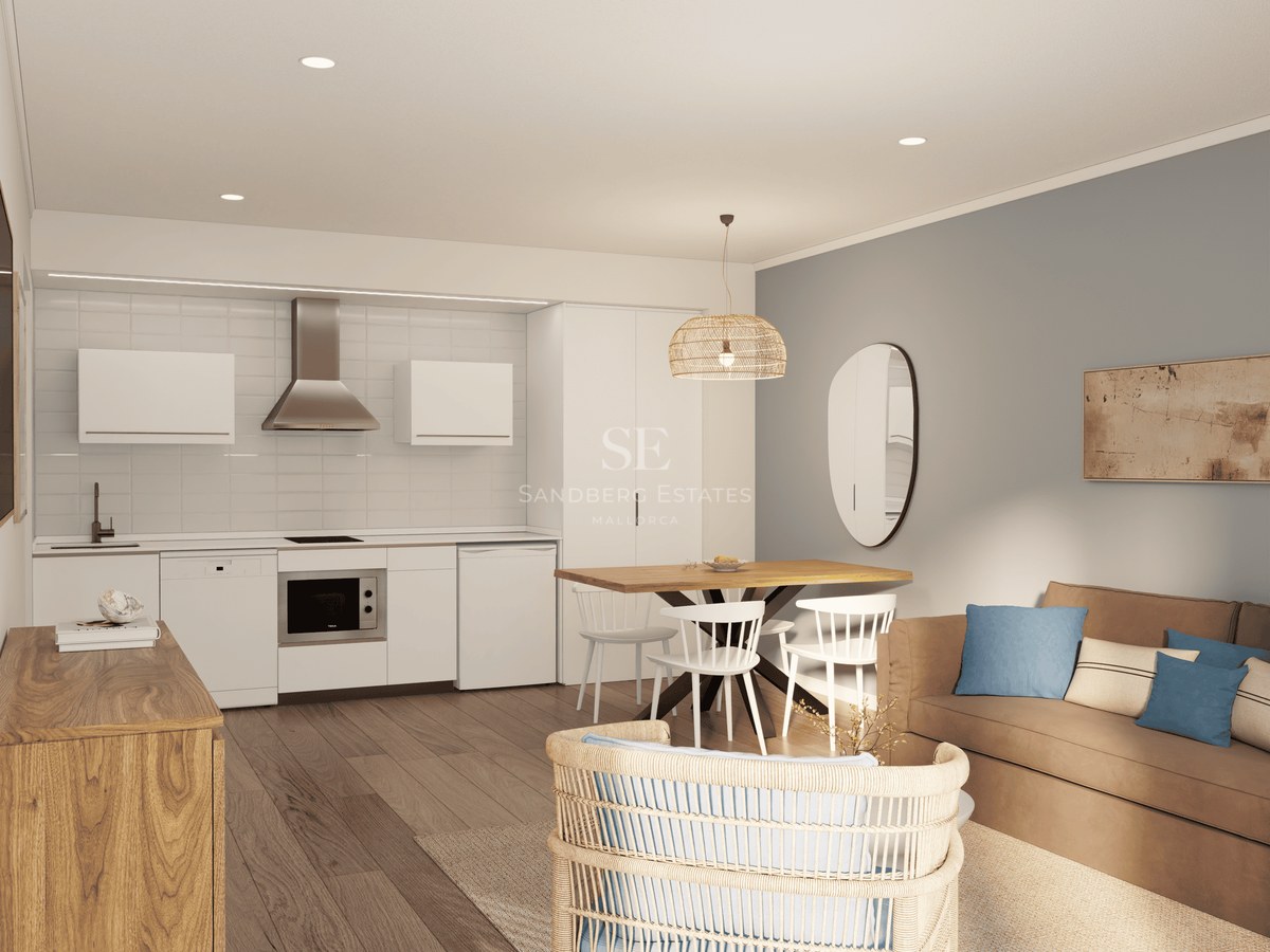 Bright open-plan room featuring a modern kitchen, wooden dining set, and a comfortable living area with a beige sofa.