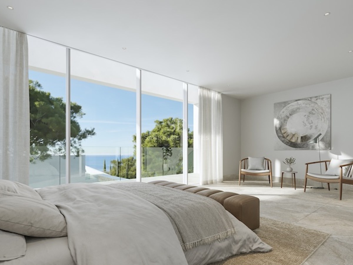 Chambre contemporaine avec baies vitrées toute hauteur ouvrant sur une terrasse avec vue mer et pins.