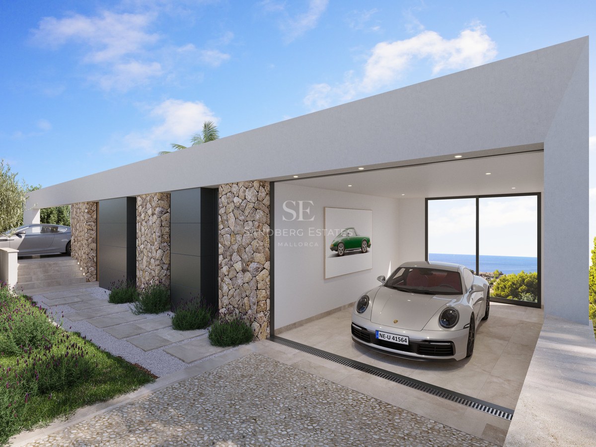 Voiture de sport argentée dans un garage blanc minimaliste avec murs en pierre et baie vitrée donnant sur l'océan.