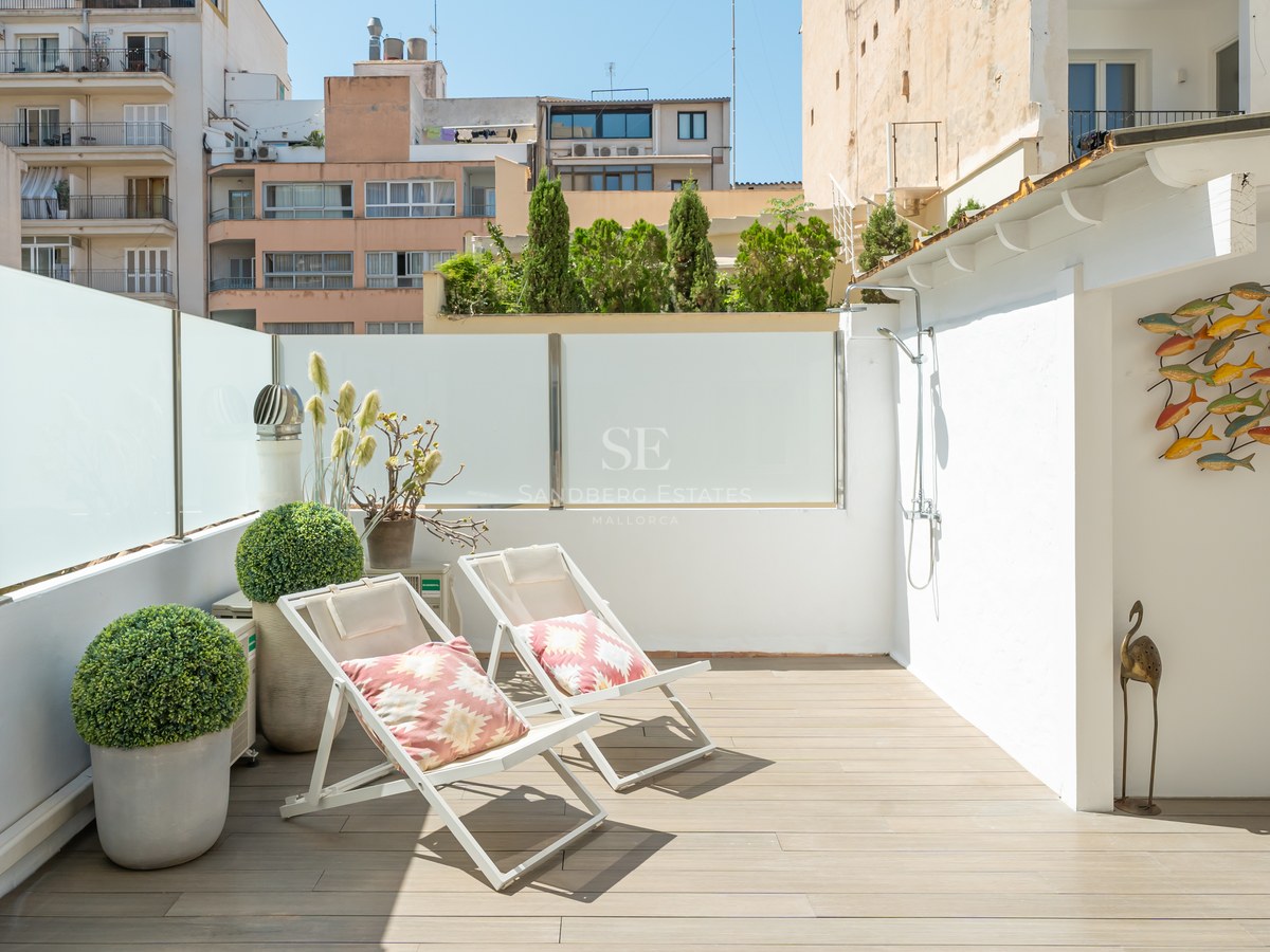 Expansive terrace with infinity pool, sun loungers, and spectacular views. Modern, minimalist design with high-quality materials.