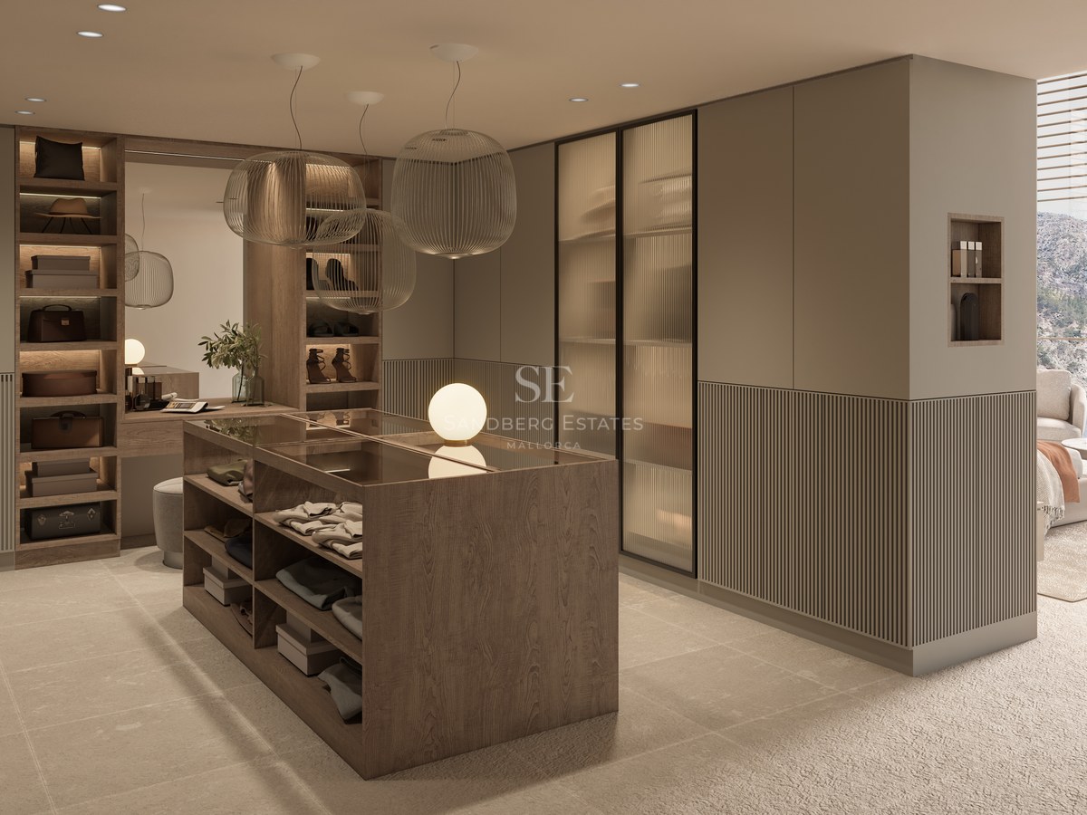 Modern dressing room featuring a central wood island, ribbed glass wardrobes, and elegant sphere pendant lights.