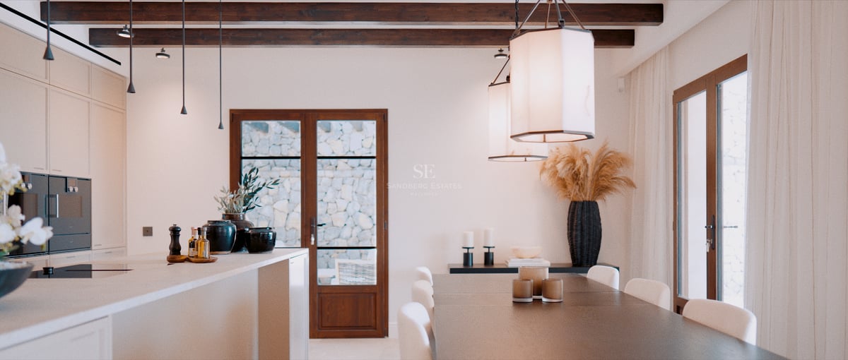 Vue intérieure d'une salle à manger moderne avec poutres en bois sombre, grande table et suspensions design.