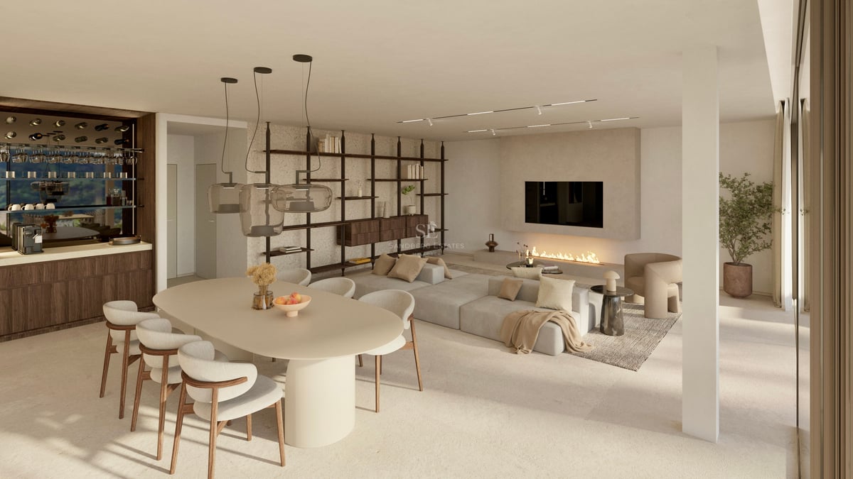 Salon moderne à plan ouvert avec grande table à manger, canapé modulaire, cheminée minimaliste et éclairage design.