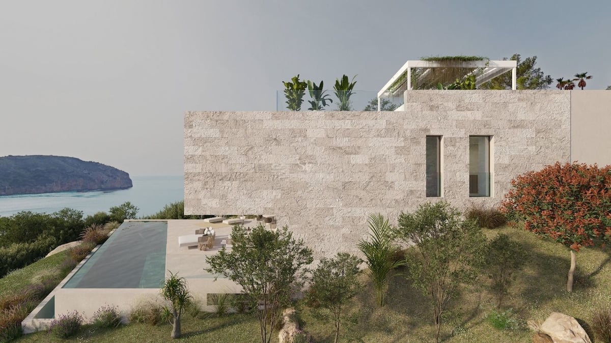 Villa moderne en pierre avec piscine à débordement face à la mer et jardin méditerranéen.