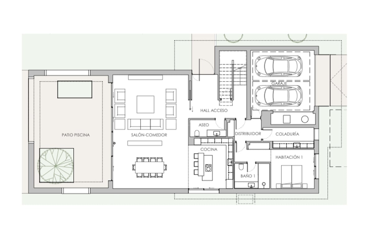 Plan architectural montrant le salon, la cuisine, une chambre avec salle de bain et un garage double.